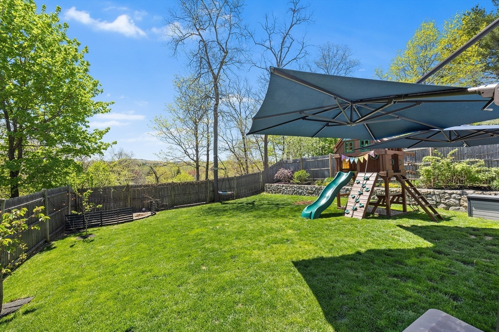 48 Hillcrest Road Waltham, MA 02451 - Photo 9 of 42 a view of a backyard with swimming pool