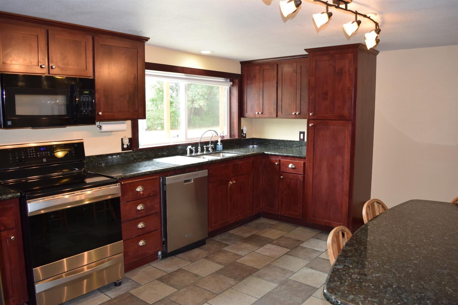 847 Big Bend Road Roseburg, OR 97471 - Photo 9 of 25 a kitchen with a sink stove and microwave