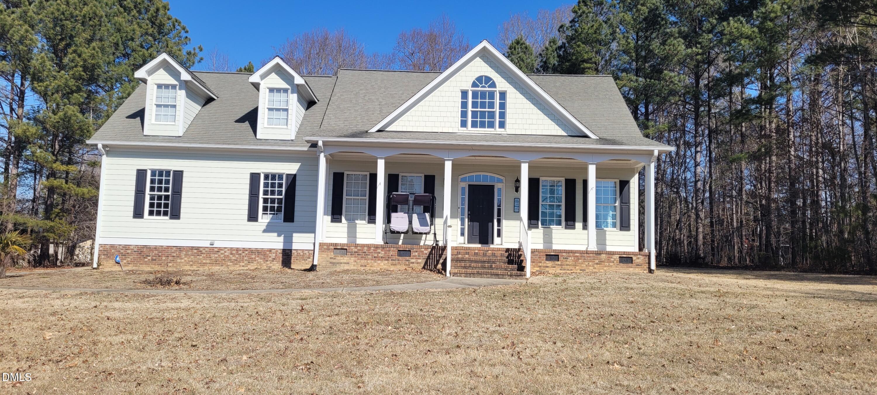226 Fletcher Ridge Road Timberlake, NC 27583 - Photo 23 of 30 a front view of a house with a garden