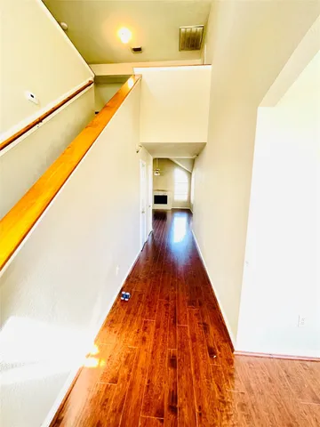 a hallway with wooden floor