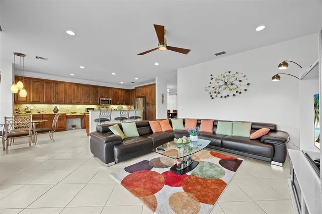 a view of a dining room with furniture and a chandelier