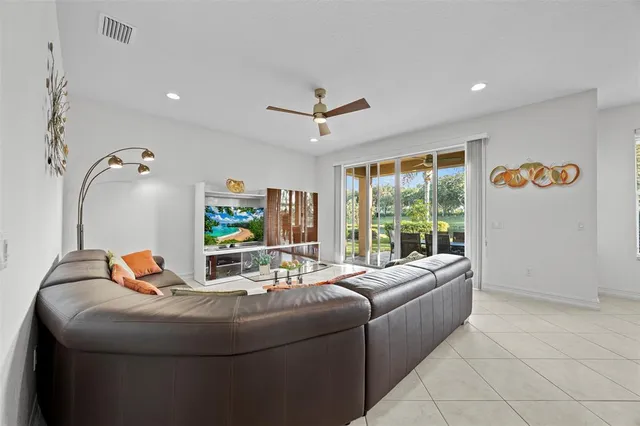 a dining room with furniture and a chandelier