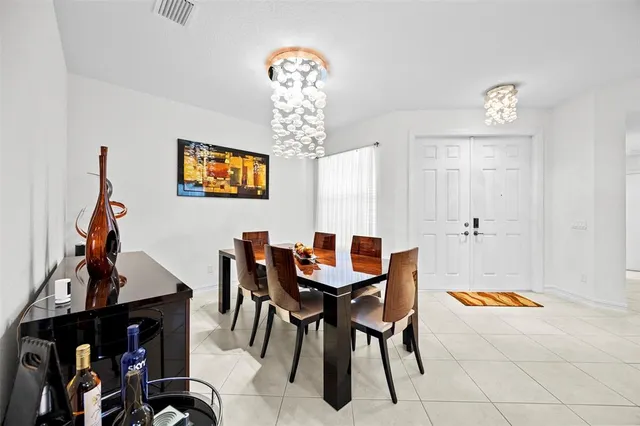 a dining room with furniture and window