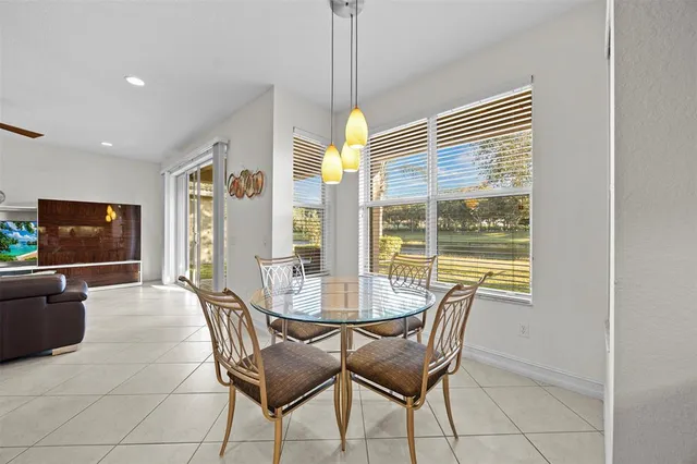 a kitchen with a stove sink microwave and cabinets