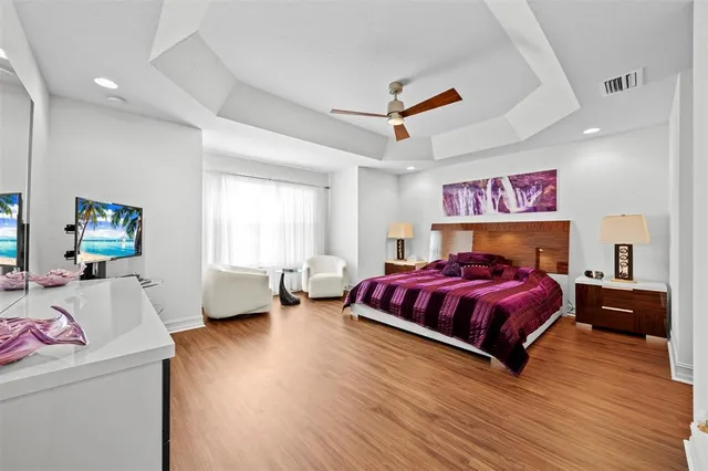 a bedroom with a bed and lamp