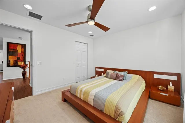 a bedroom with a bed and a lamp