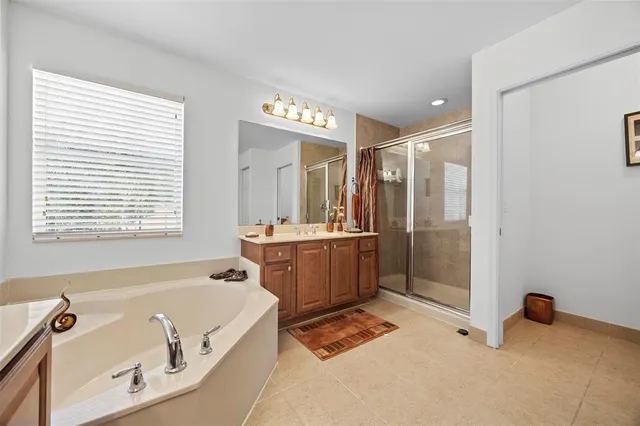 an aerial view of residential houses with outdoor space and swimming pool