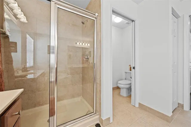 an aerial view of a house with a lake view