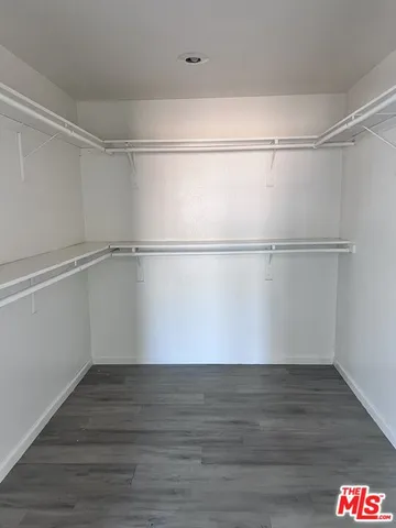 a view of an empty walk in closet