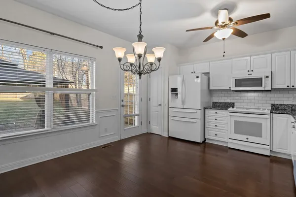a view of a kitchen with stove and cabinets