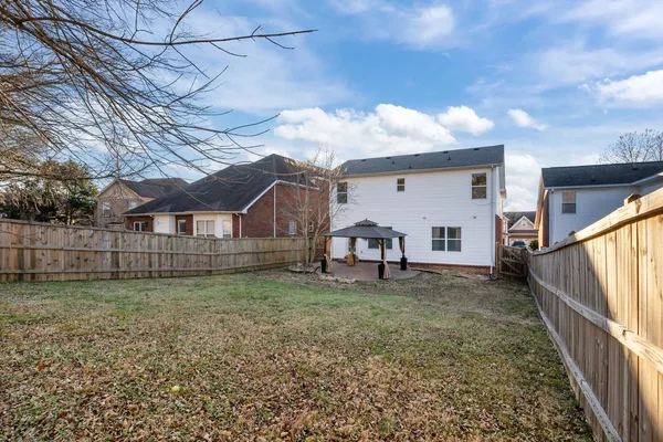 a house view with a backyard space