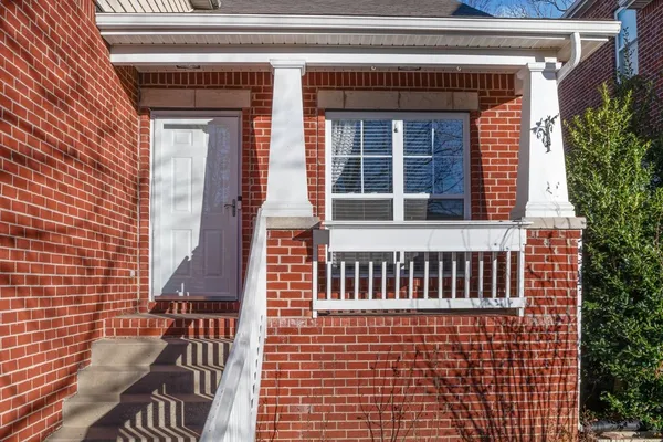 a view of a brick house with a window