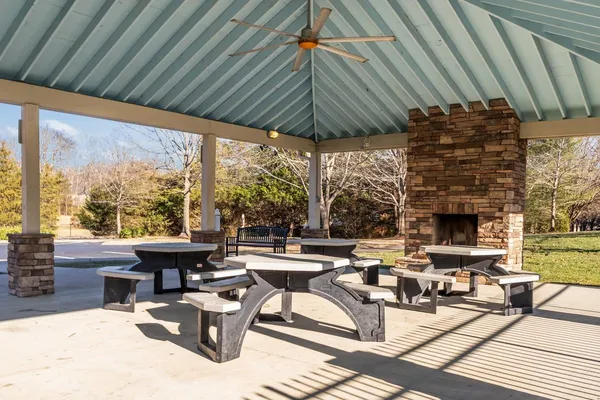 a outdoor space with patio the couches and a dining table with the garden view