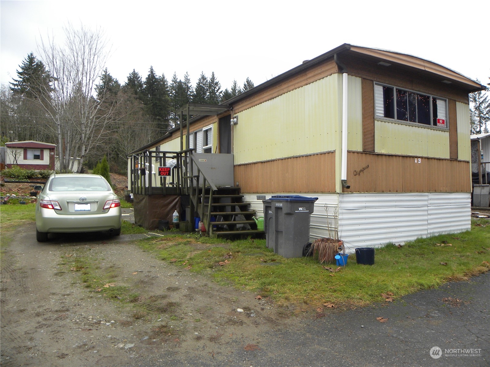15503 Cedar Park Road Southeast, Unit 14 Olalla, WA 98359 - Photo 1 of 31 a car parked in front of a house