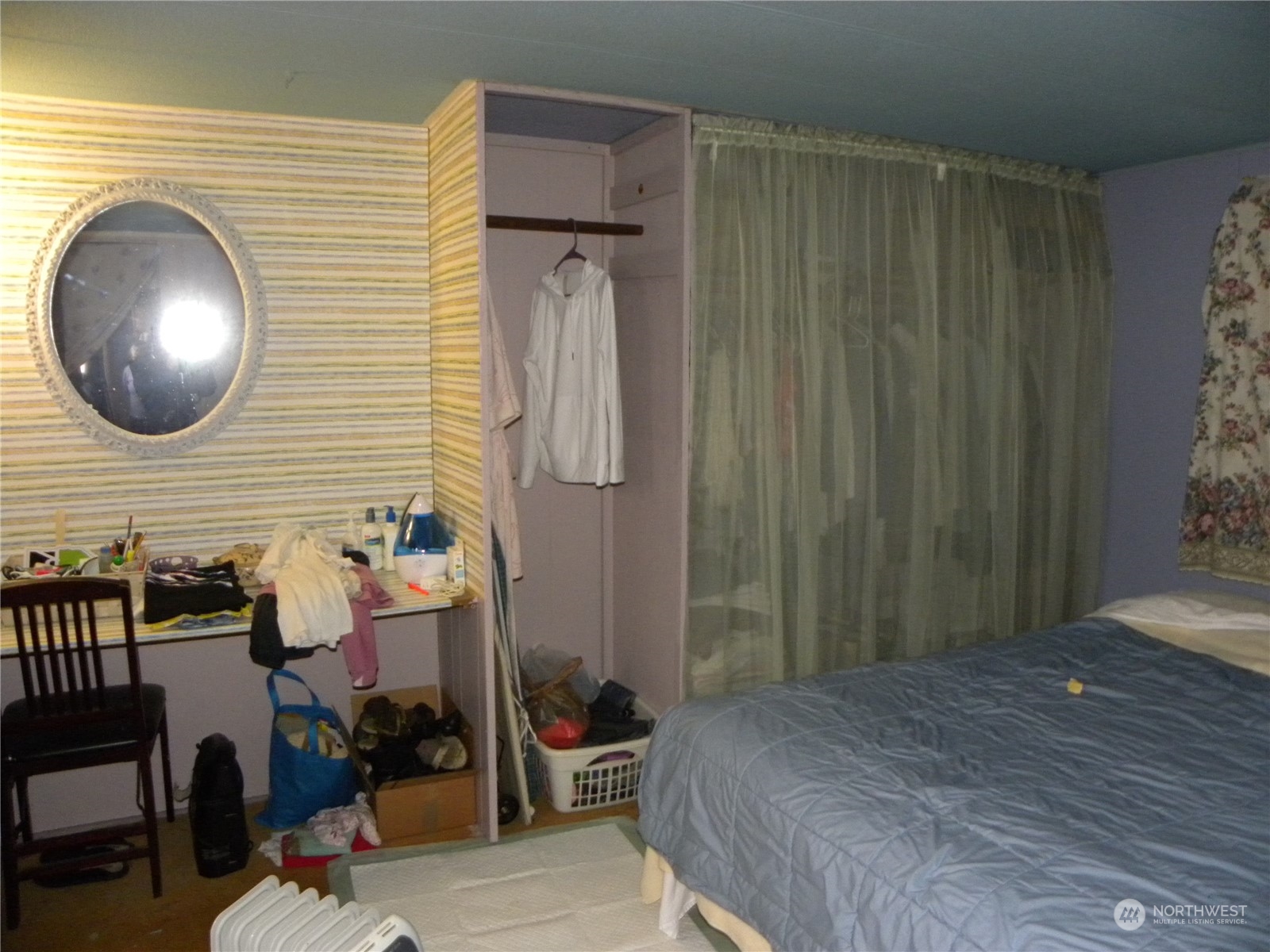 15503 Cedar Park Road Southeast, Unit 14 Olalla, WA 98359 - Photo 11 of 31 a bedroom with a bed and a chair