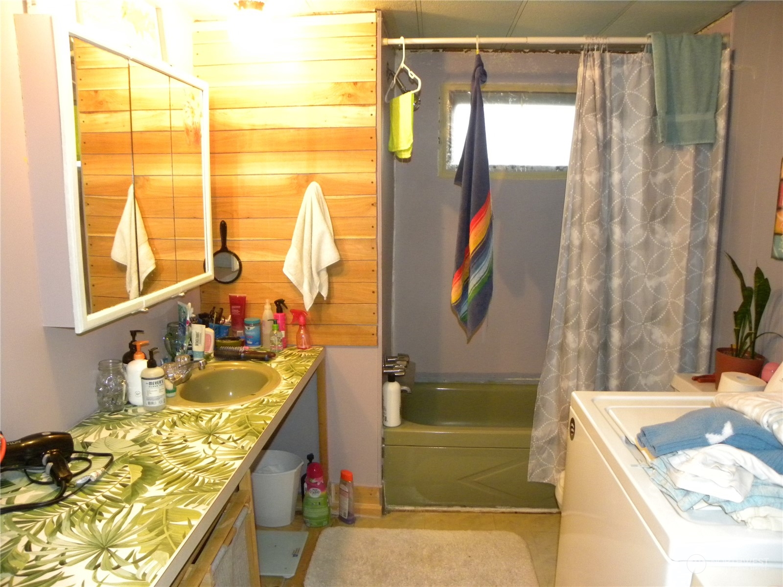 15503 Cedar Park Road Southeast, Unit 14 Olalla, WA 98359 - Photo 13 of 31 a bathroom with a tub sink and mirror