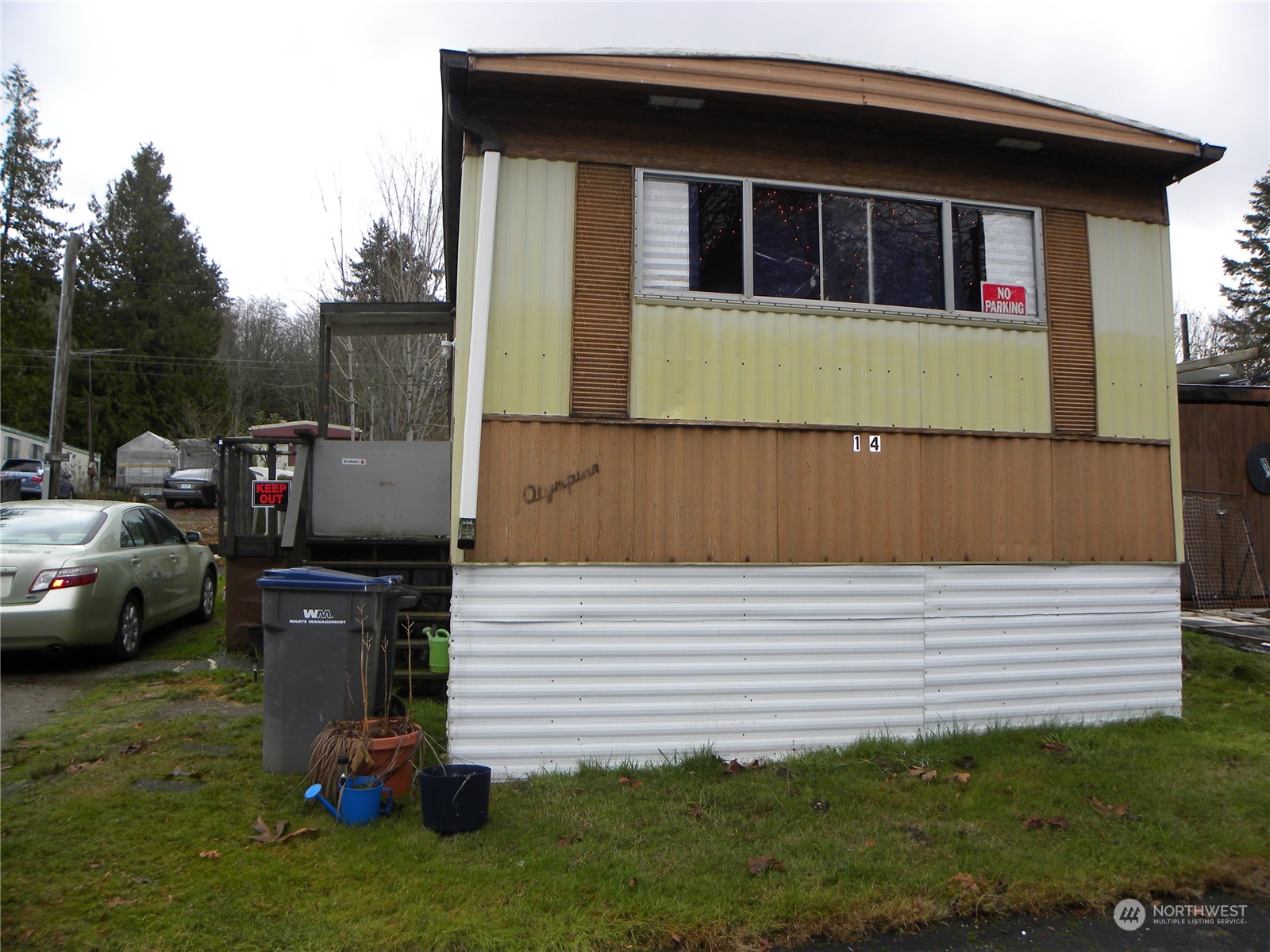 15503 Cedar Park Road Southeast, Unit 14 Olalla, WA 98359 - Photo 20 of 31 a side view of a house with a garden