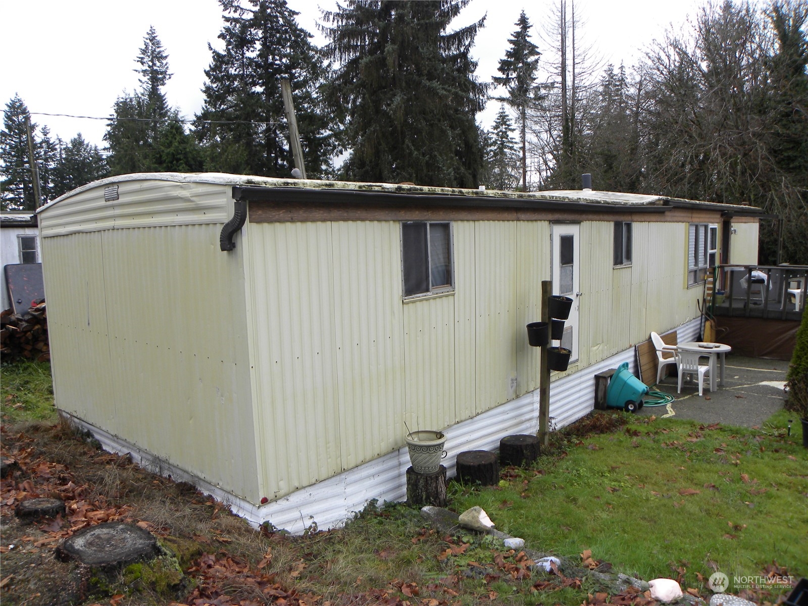 15503 Cedar Park Road Southeast, Unit 14 Olalla, WA 98359 - Photo 21 of 31 a view of a small house and a yard