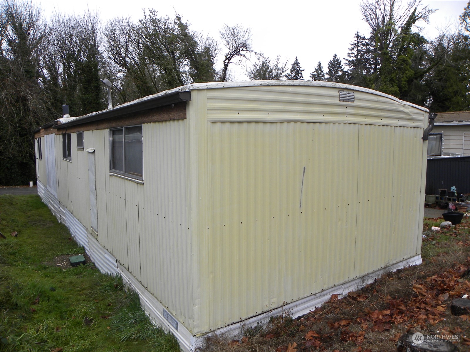 15503 Cedar Park Road Southeast, Unit 14 Olalla, WA 98359 - Photo 29 of 31 a side view of a house with backyard