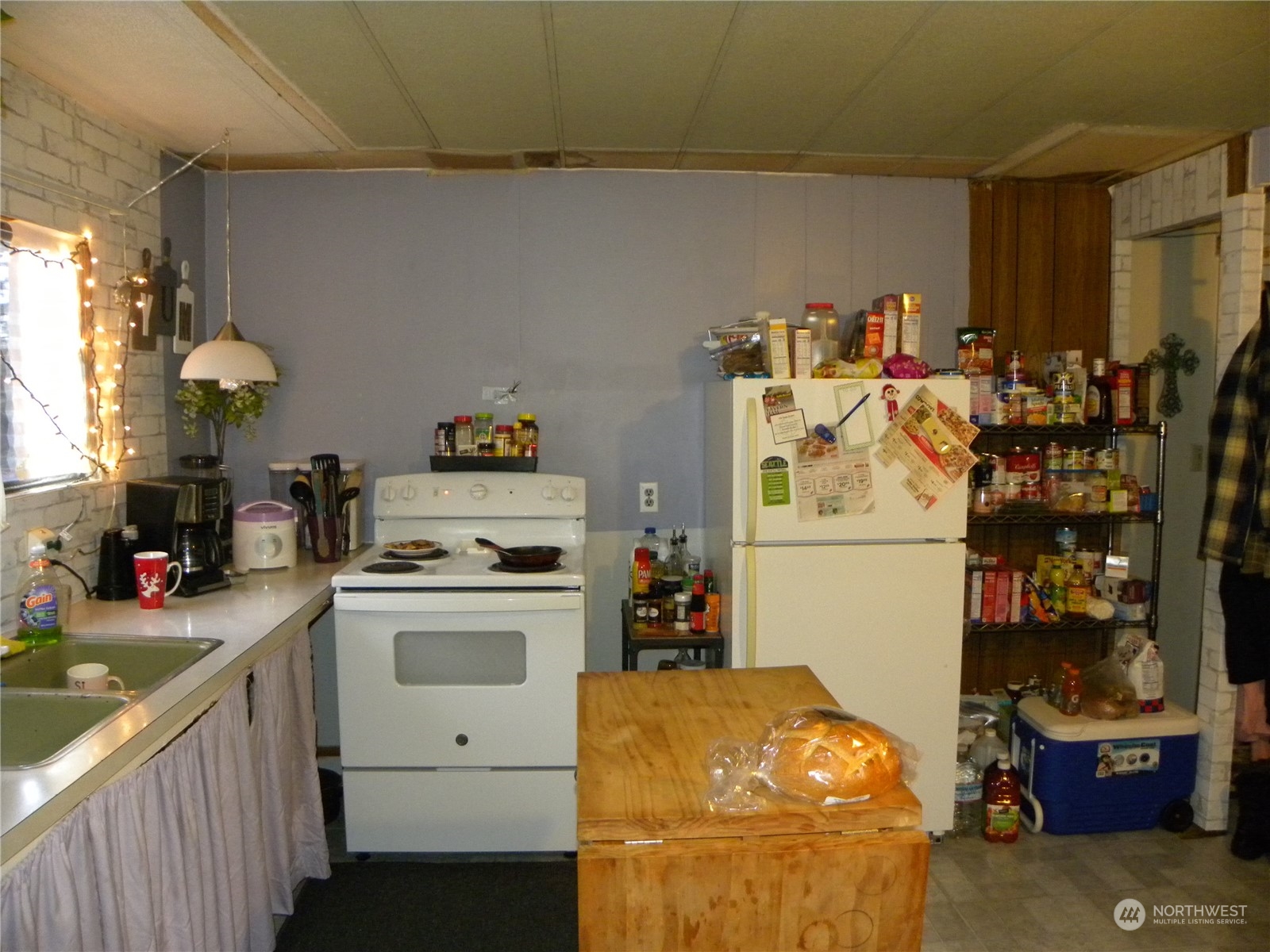 15503 Cedar Park Road Southeast, Unit 14 Olalla, WA 98359 - Photo 5 of 31 a storage room with washer and dryer
