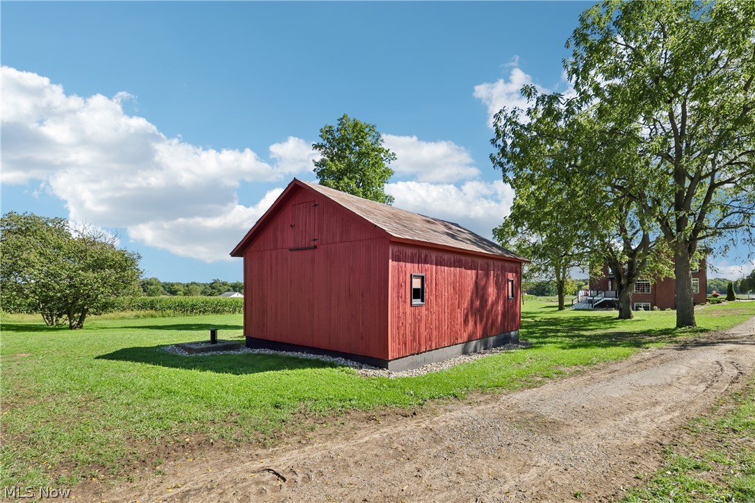 3636 Salem-Unity Road Columbiana, OH 44408 - Photo 44 of 50 Red barn with a gable roof, wood siding, and multiple windows