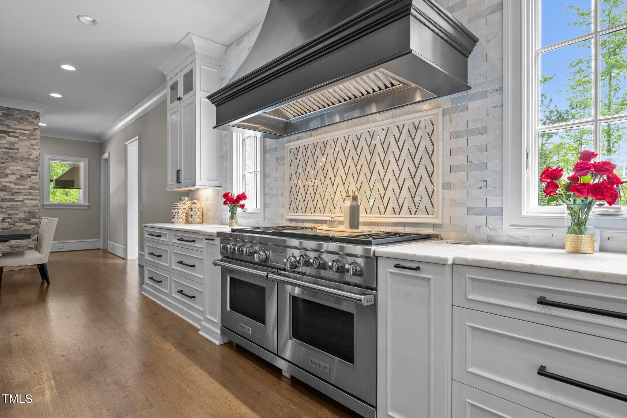 1416 Bailey Hill Drive Raleigh, NC 27614 - Photo 14 of 71 a kitchen with granite countertop a stove and cabinets