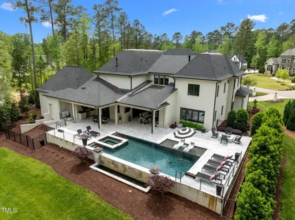 an aerial view of a house with swimming pool