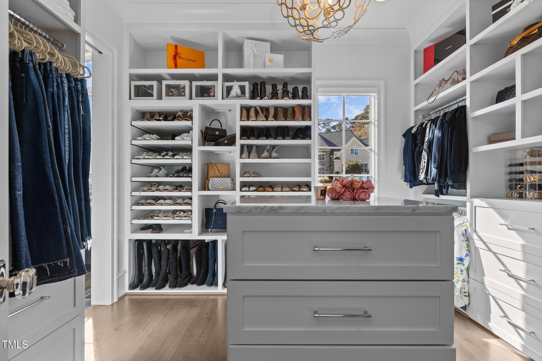 1416 Bailey Hill Drive Raleigh, NC 27614 - Photo 36 of 71 a view of walk in closet with clothes and shoes