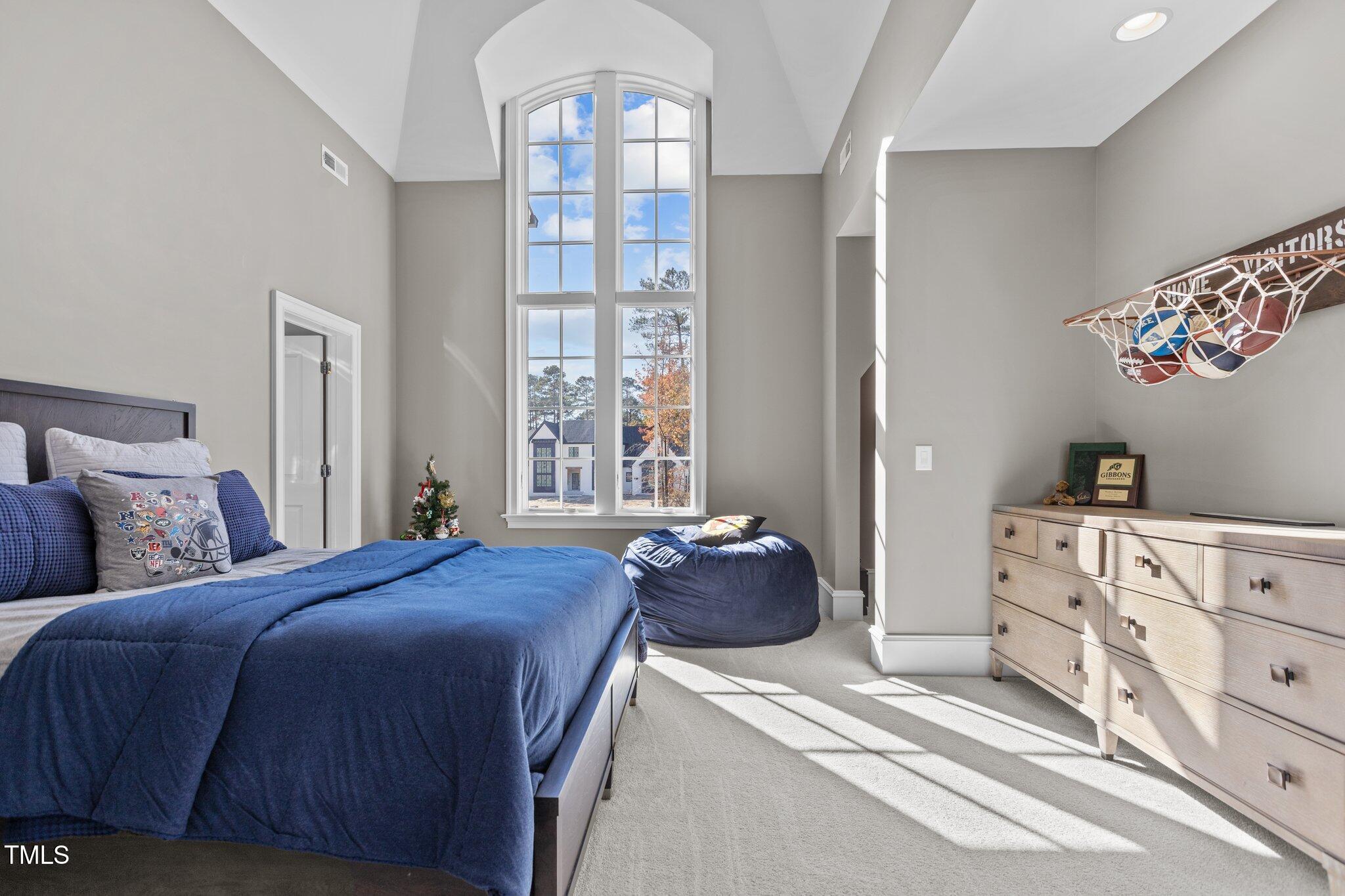 1416 Bailey Hill Drive Raleigh, NC 27614 - Photo 41 of 71 a bedroom with a bed and a window