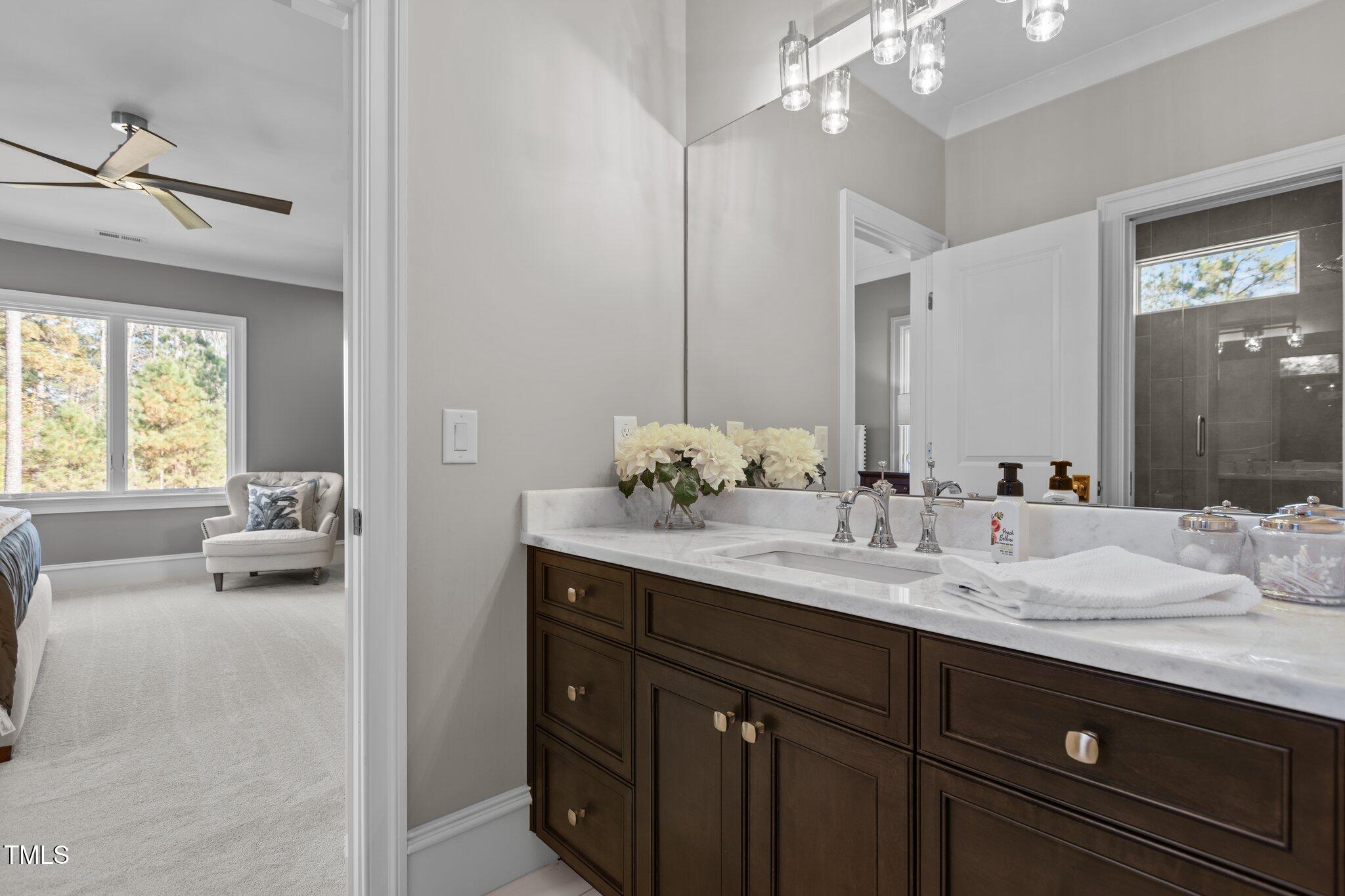 1416 Bailey Hill Drive Raleigh, NC 27614 - Photo 44 of 71 a en suite bathroom with a sink double vanity granite and a mirror