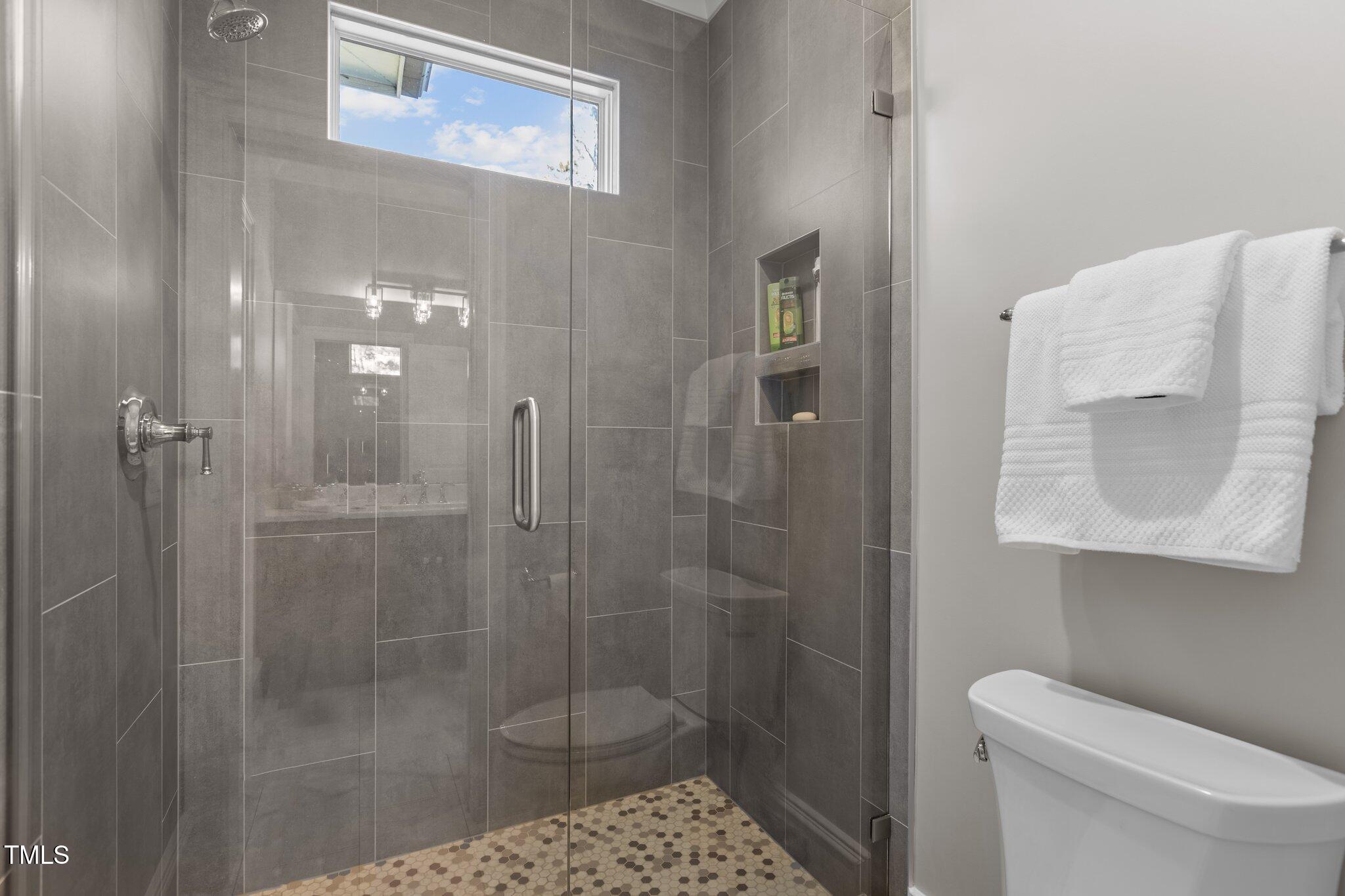 1416 Bailey Hill Drive Raleigh, NC 27614 - Photo 45 of 71 a bathroom with a shower and toilet