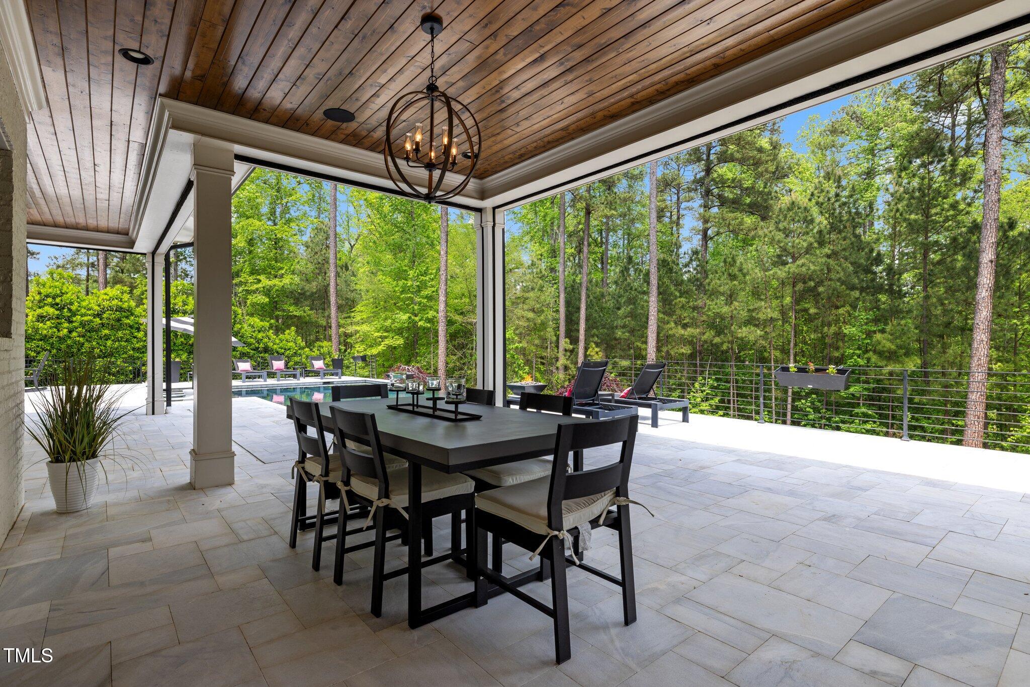 1416 Bailey Hill Drive Raleigh, NC 27614 - Photo 54 of 71 a view of a patio with a table chairs and a table