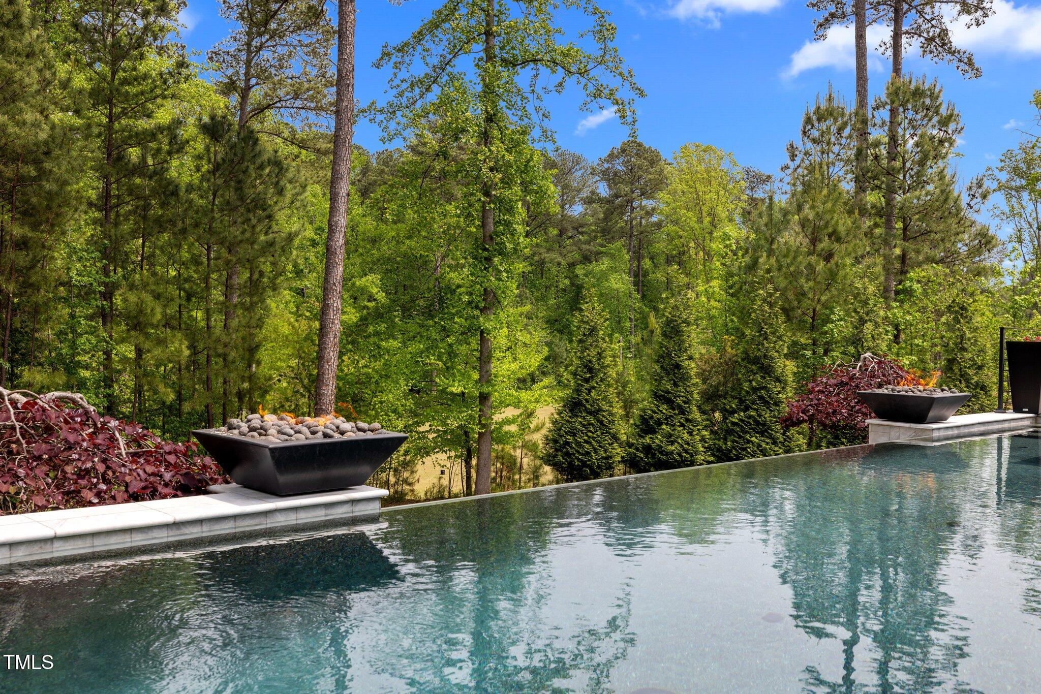 1416 Bailey Hill Drive Raleigh, NC 27614 - Photo 58 of 71 a view of a lake with a house in the background