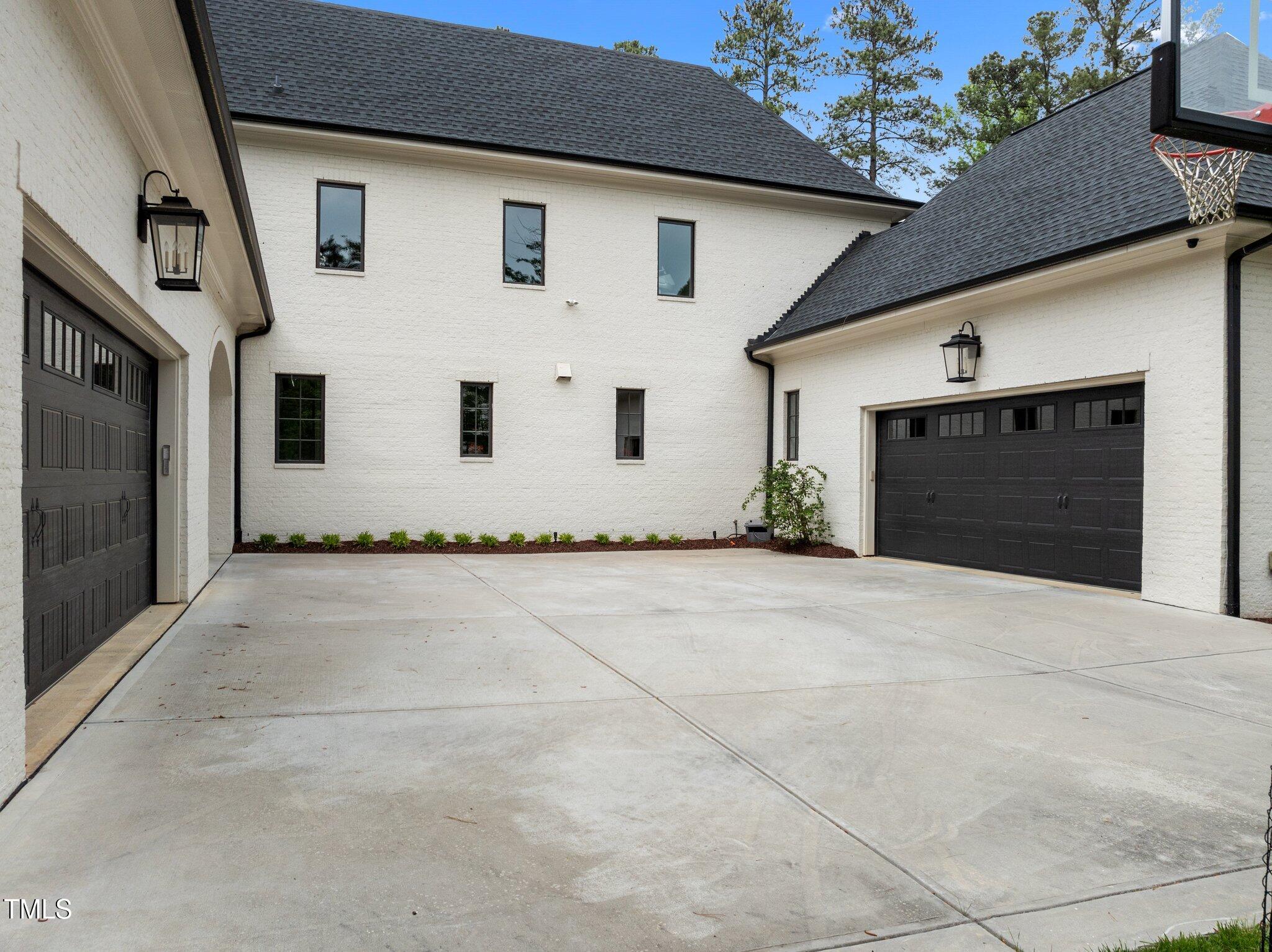 1416 Bailey Hill Drive Raleigh, NC 27614 - Photo 66 of 71 a front view of a house with a yard and garage