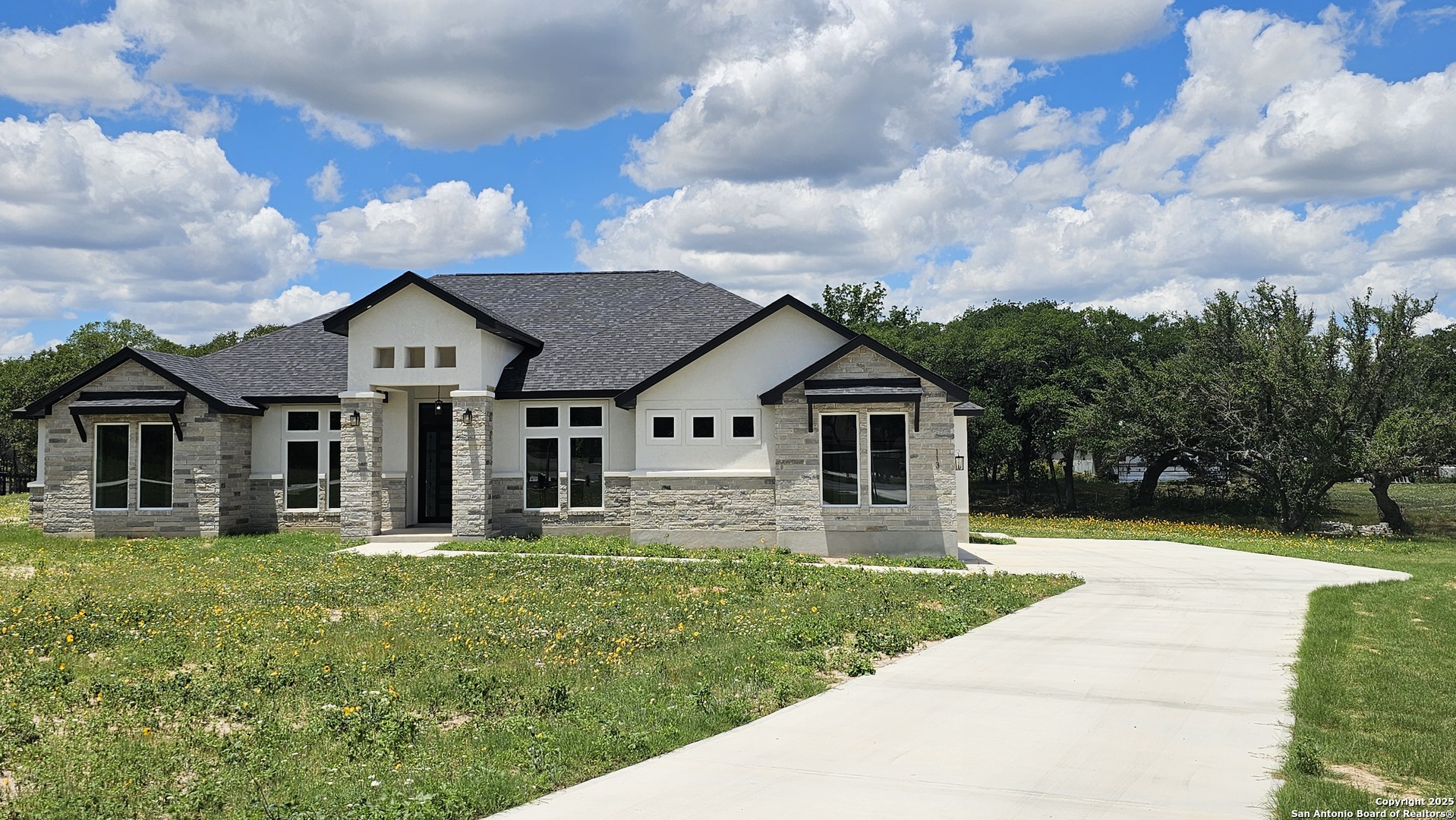 113 Hunting Ridge Drive La Vernia, TX 78121 - Photo 1 of 1 a front view of a house with a yard
