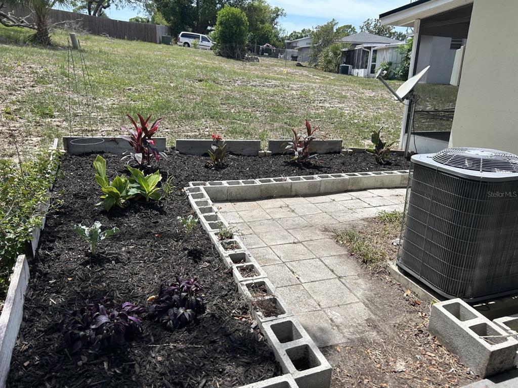 1241 Pilgrim Road Spring Hill, FL 34606 - Photo 24 of 28 a view of a pathway with a yard