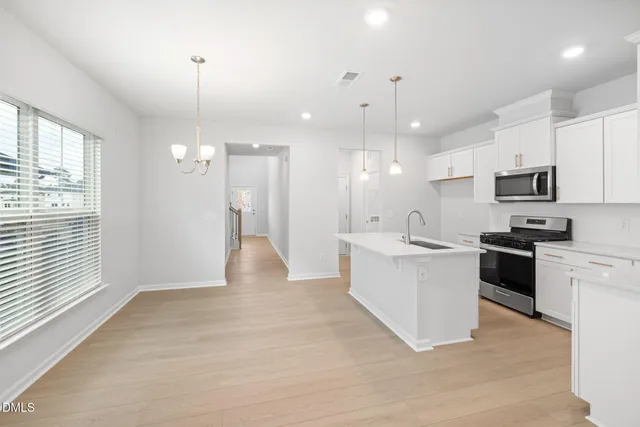 a large kitchen with cabinets