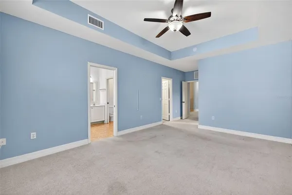 a view of a balcony with yard