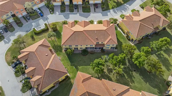 an aerial view of residential houses with outdoor space