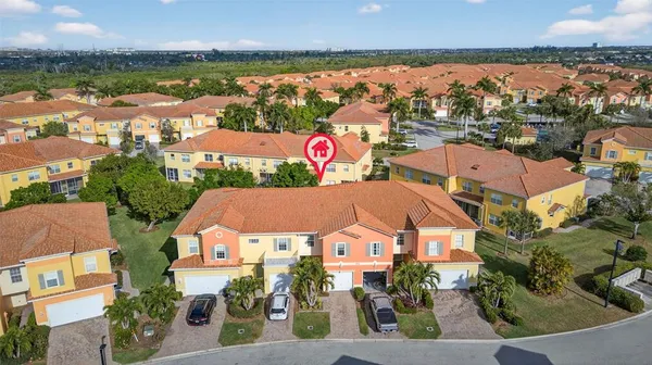 an aerial view of residential building and lake