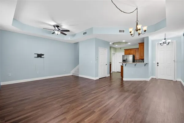 a view of walk in closet with wooden floor