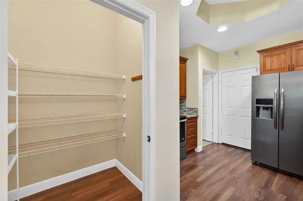 a kitchen that has a sink cabinets counter space and stainless steel appliances