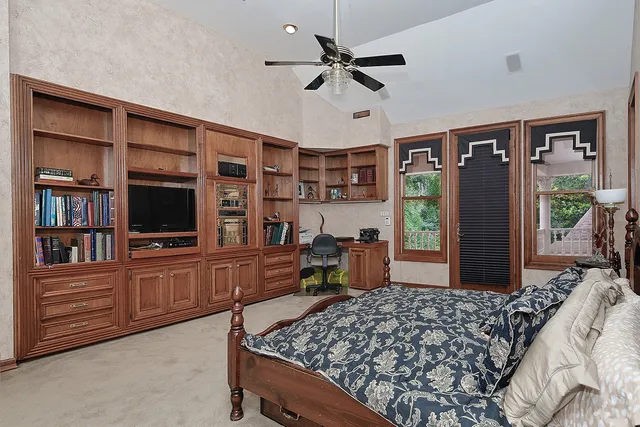 a bed room with a bed and a television