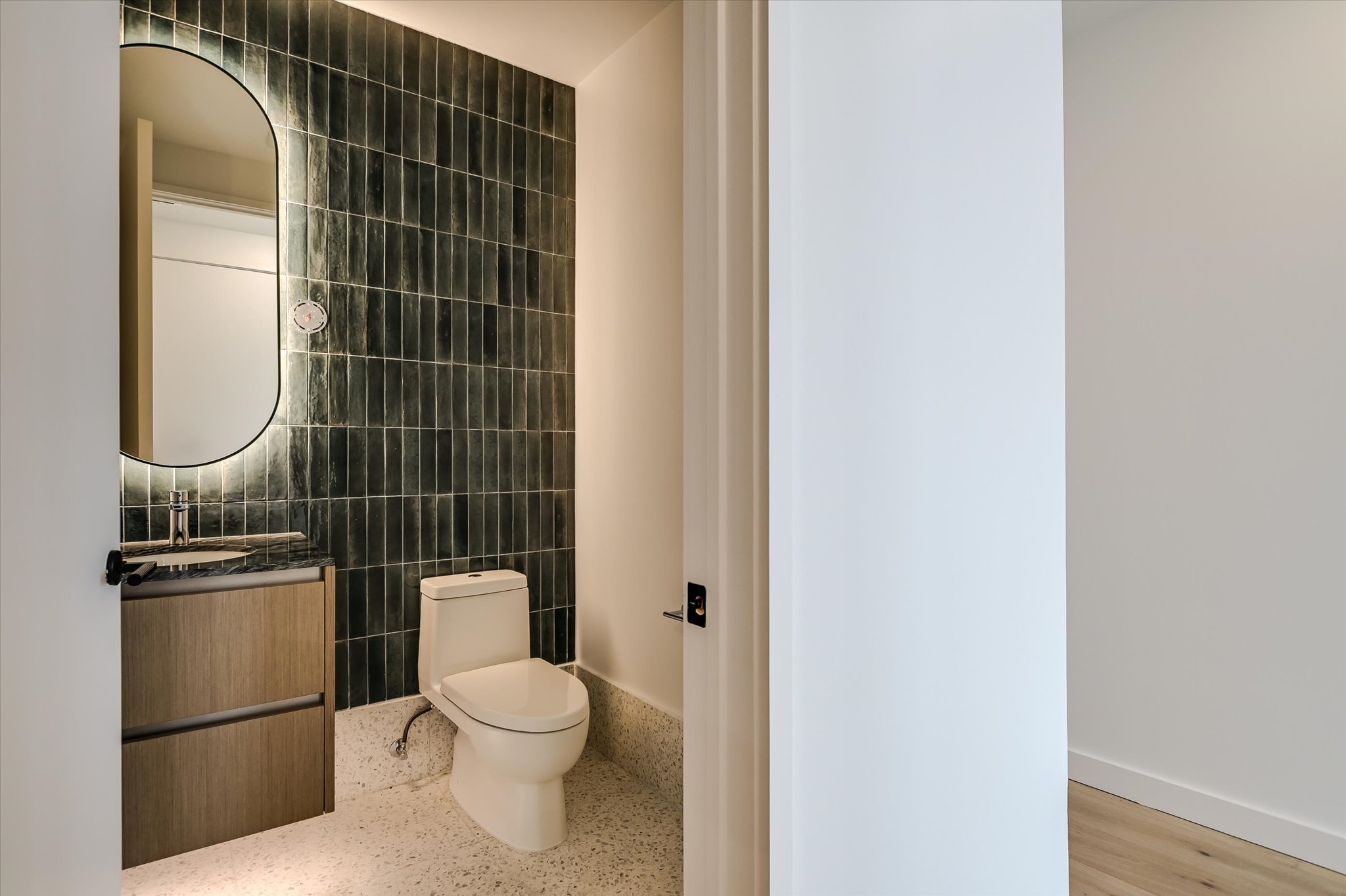 610 Davis Street, Unit 4704 Austin, TX 78701 - Photo 25 of 40 a white toilet sitting next to a bathroom sink