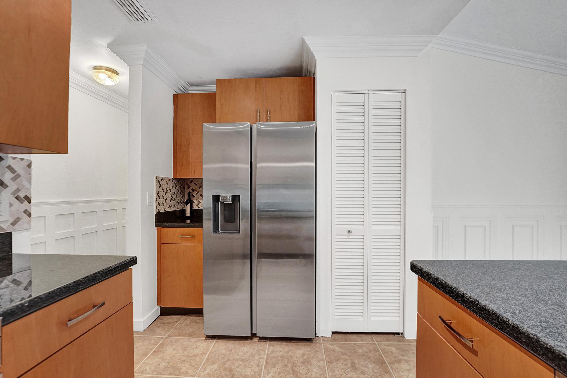 2941 Northwest 24th Way Boca Raton, FL 33431 - Photo 20 of 53 a kitchen with a refrigerator and a sink
