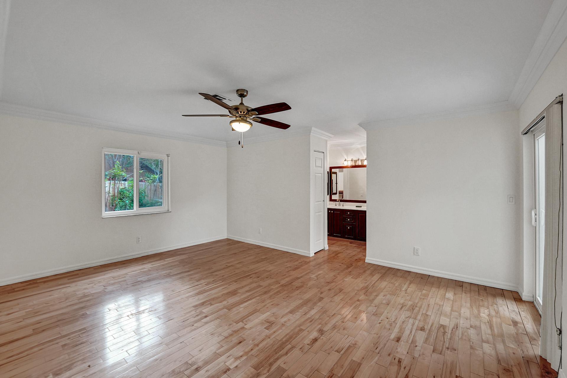 2941 Northwest 24th Way Boca Raton, FL 33431 - Photo 23 of 53 wooden floor in an empty room with a window