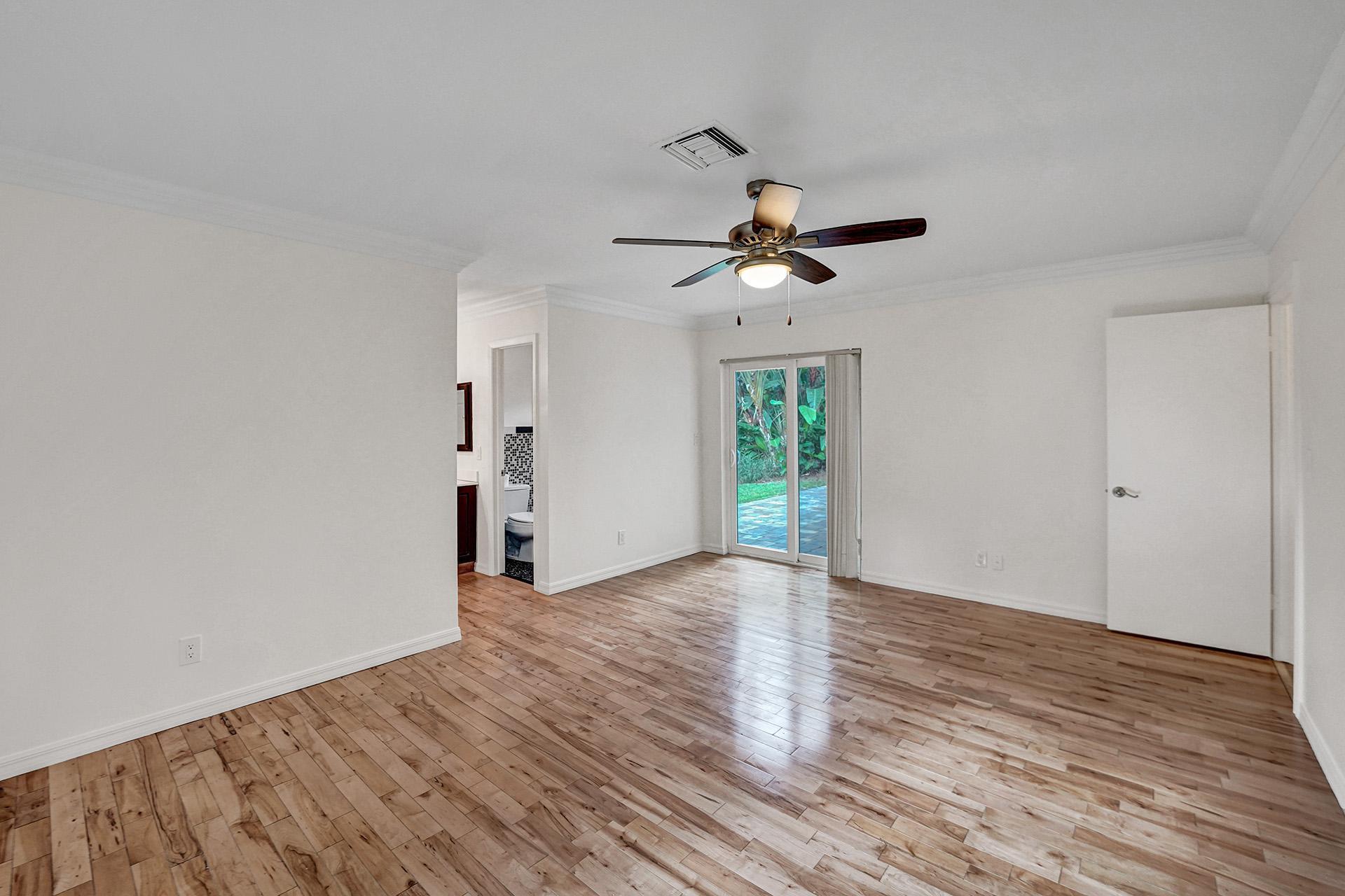 2941 Northwest 24th Way Boca Raton, FL 33431 - Photo 24 of 53 wooden floor in an empty room with a window