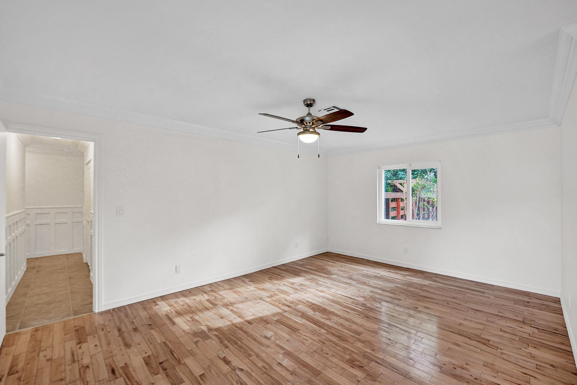 2941 Northwest 24th Way Boca Raton, FL 33431 - Photo 28 of 53 a view of empty room with wooden floor