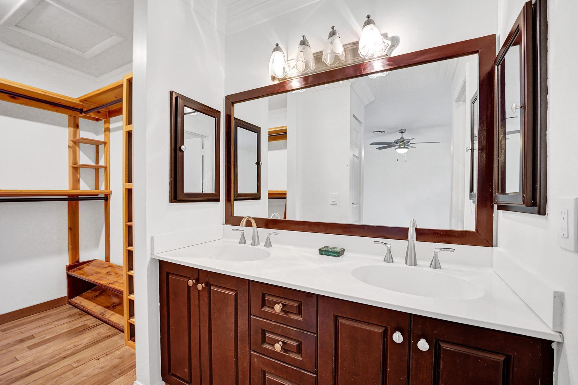 2941 Northwest 24th Way Boca Raton, FL 33431 - Photo 29 of 53 a bathroom with a double vanity sink and a mirror