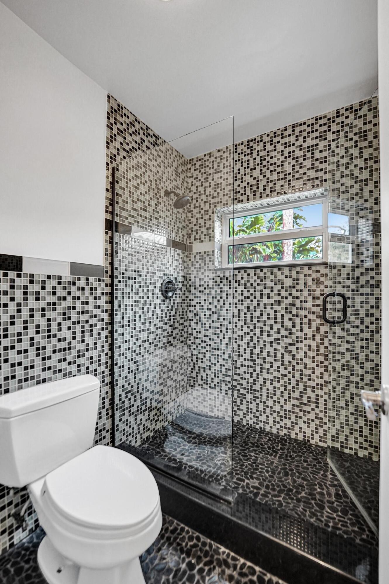 2941 Northwest 24th Way Boca Raton, FL 33431 - Photo 30 of 53 a bathroom with a toilet and a shower